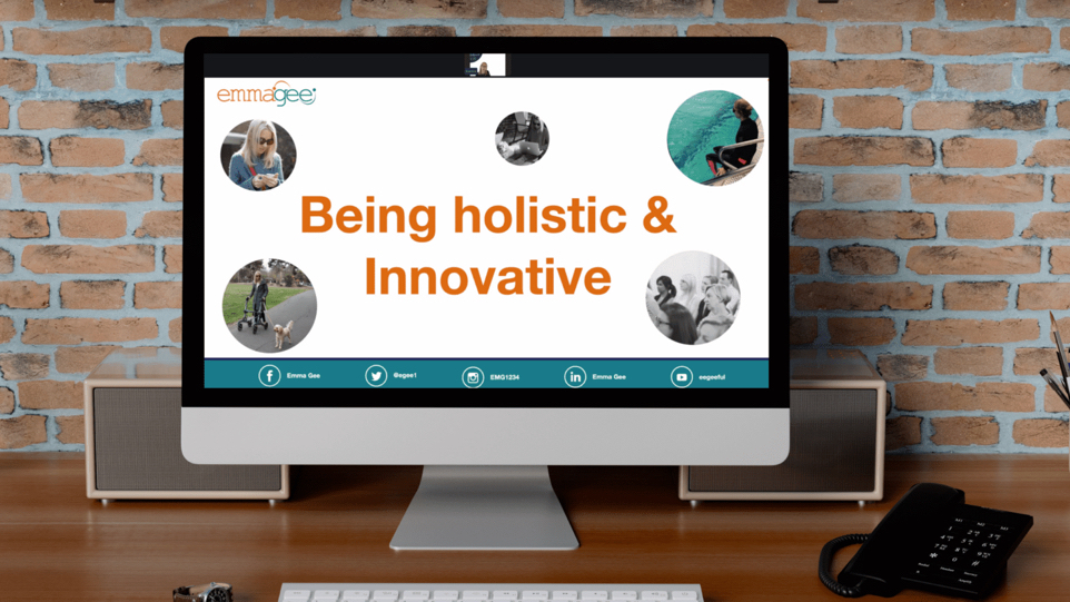 A computer screen with a slide on it that reads "Being holistic & innocative" 